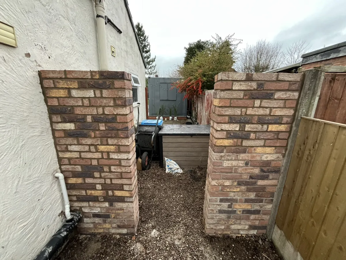 Reclaimed-brick pillars by RLG Construction