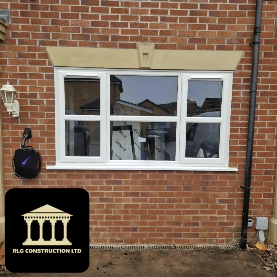 The same opening bricked up to match the house with a new window under the stone lintel